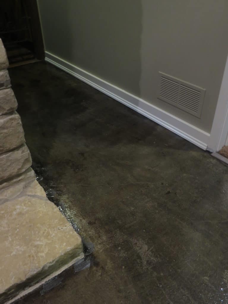 Stained Concrete Floors withe the added shoe molding to cover the gap from where the carpet used to be.