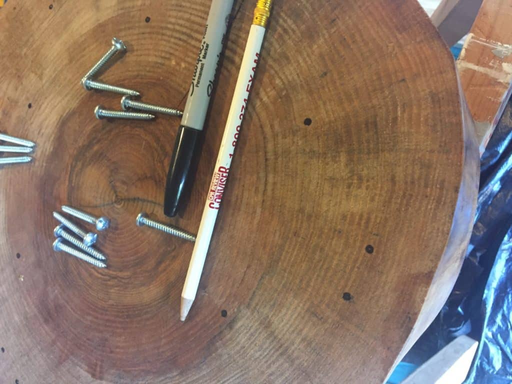 I marked where each screw is going to go into the wood using a sharpie so I could drill pilot holes.