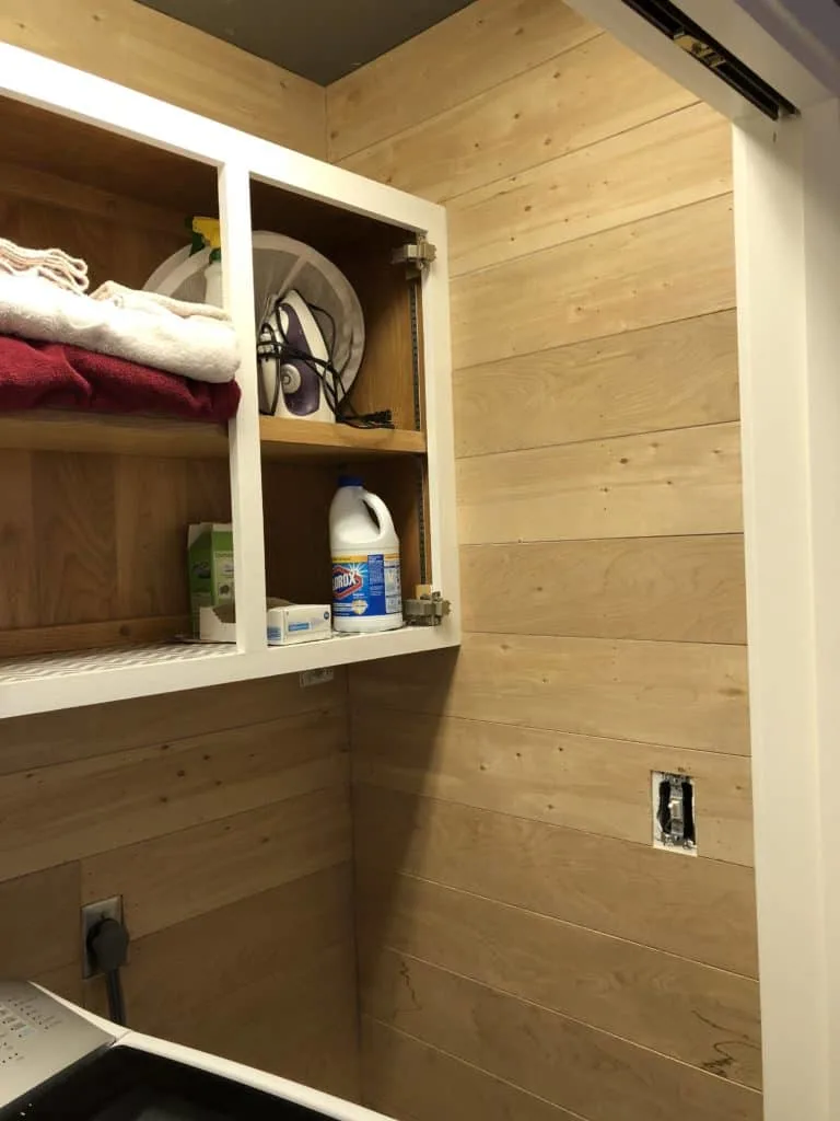 The laundry room shiplap walls are installed.