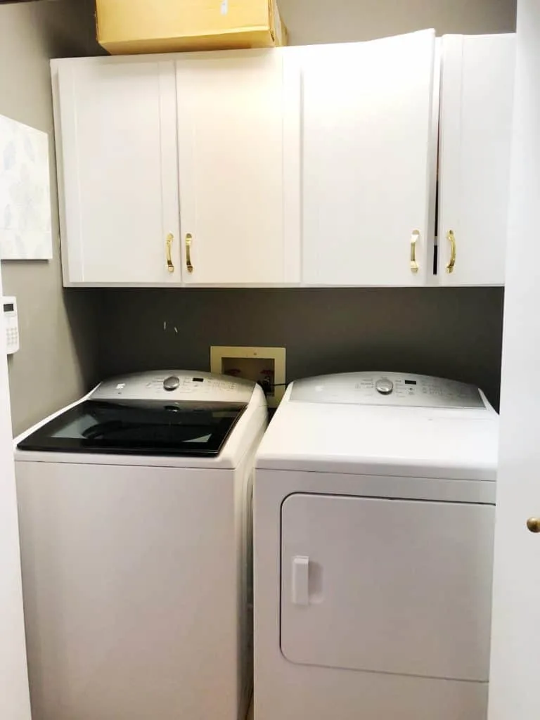 Laundry room ideas for making over this outdated and dirty laundry room.