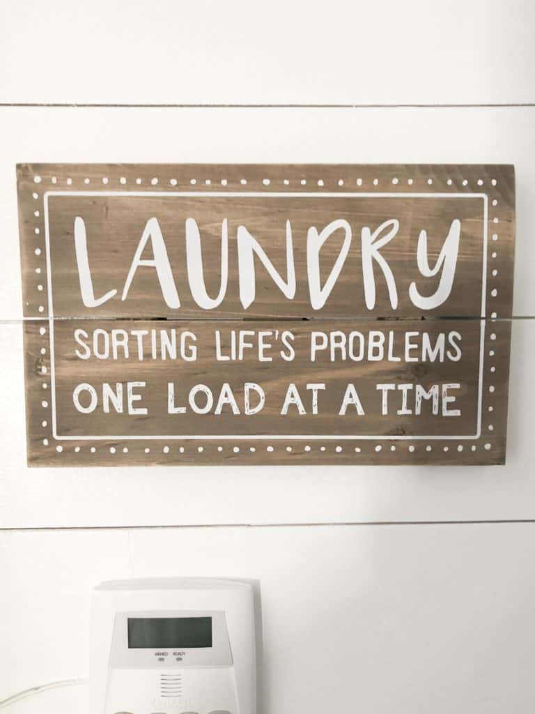 This farmhouse laundry sign says sorting life's problems one load at a time.