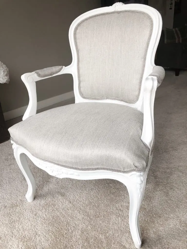 The finished reupholstered chair.