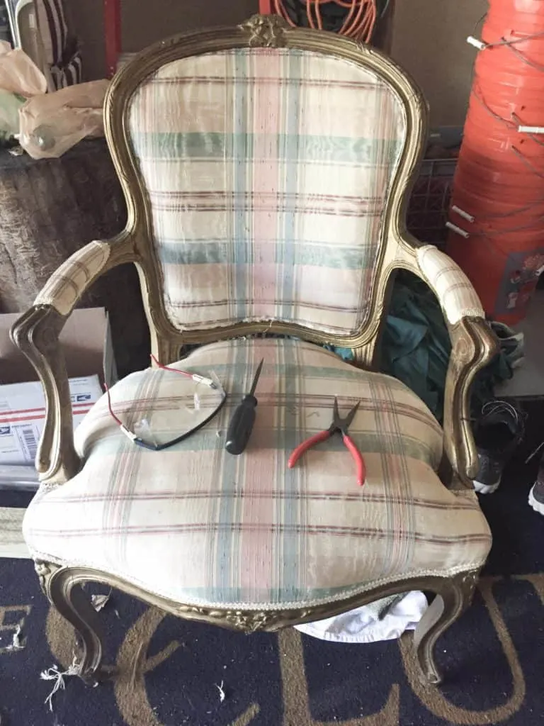The French chair with gold paint and plaid fabric and the tools I used to rip the fabric off on the seat of the chair. 