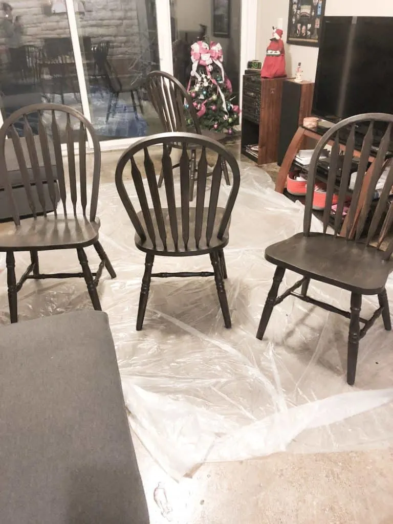 All the chairs with one coat of black paint.