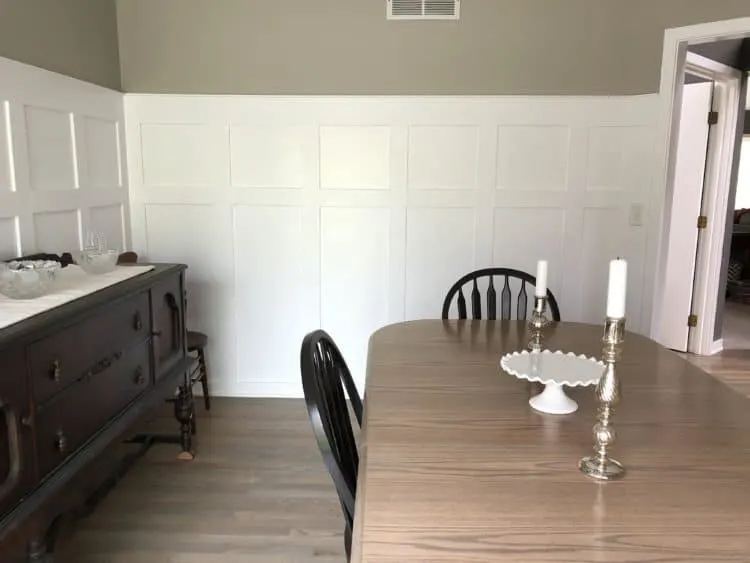 DIY Board and Batten with the gray stained dining table and black chairs.