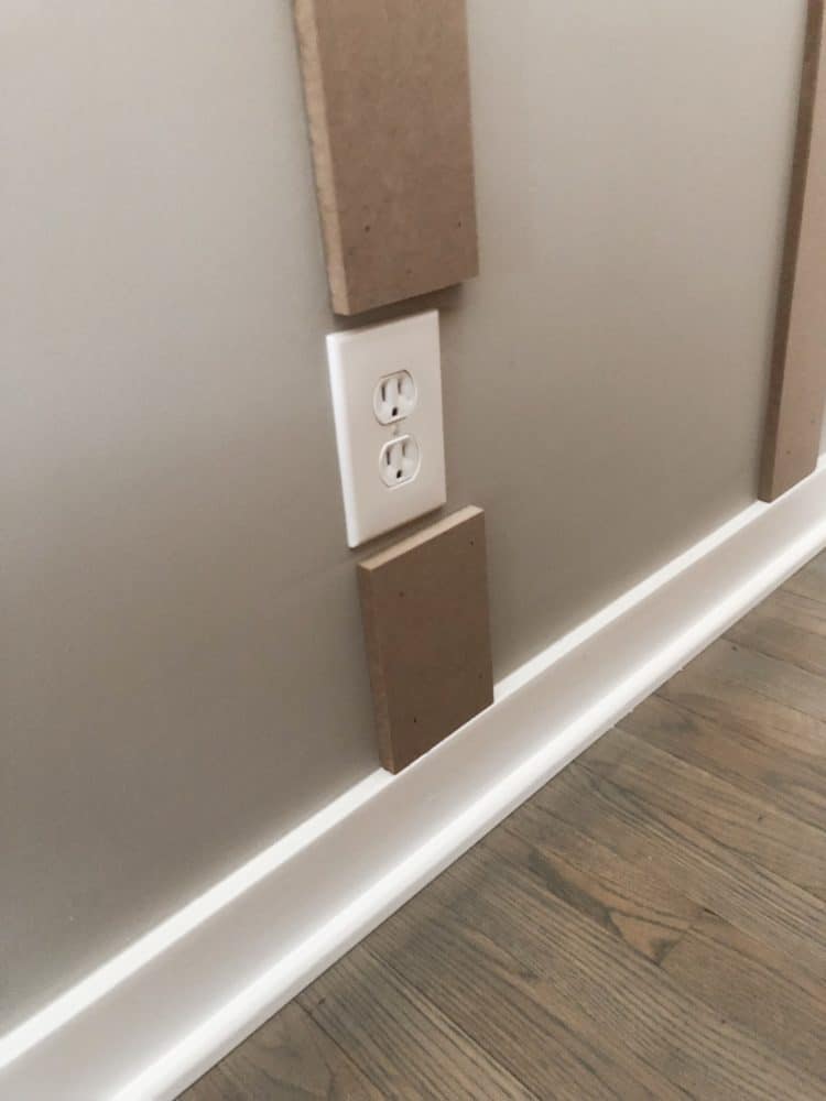 DIY Board and batten, how I stopped the wood and started up again around the outlet.