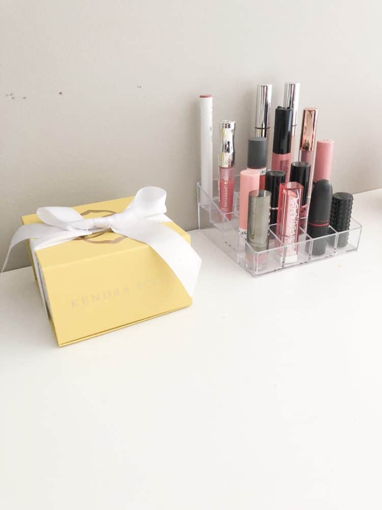 A small acrylic set of cubes to hold lipsticks and a small decorative box from Kendra Scott.