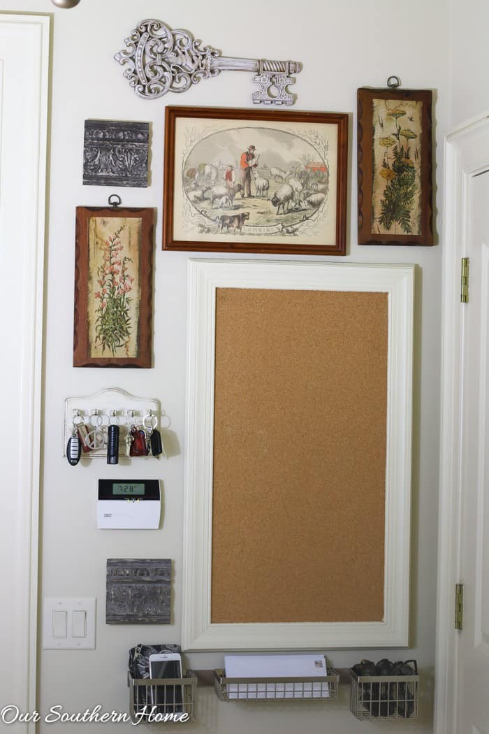 A command center with a huge cork board and a string of hooks for keys.