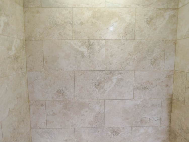The shower tile has been grouted.