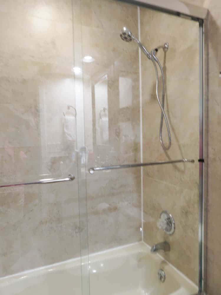 The shower doors have been re-installed as well as the shower head.