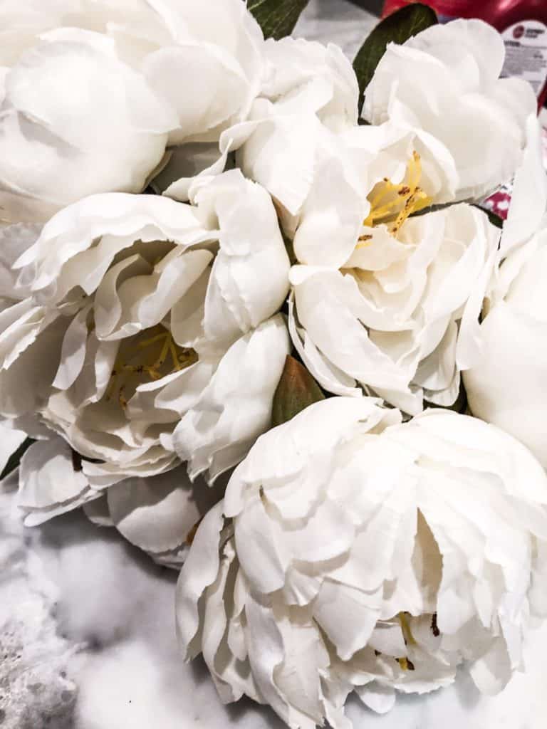 White peonies for a pumpkin floral arrangement.