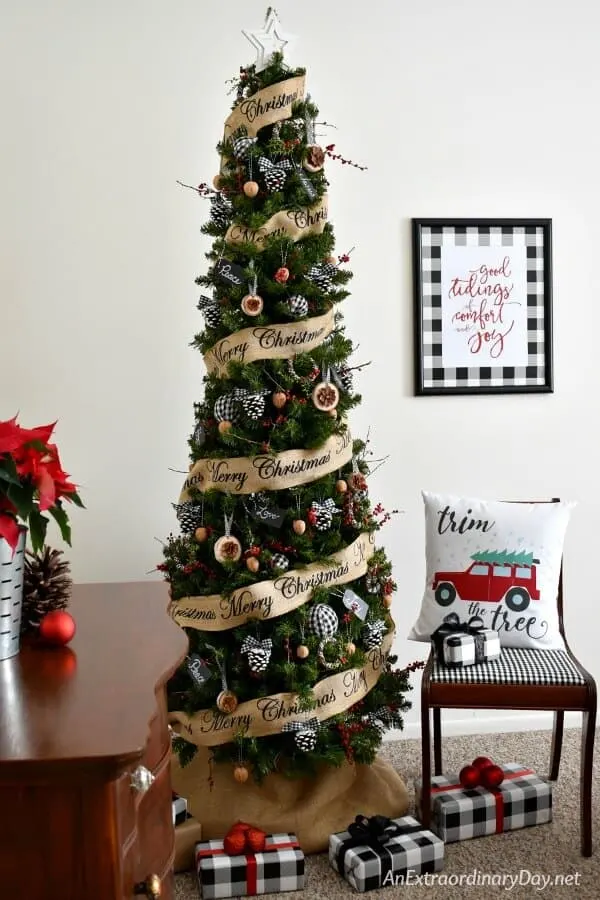 Farmhouse Christmas decor - here is a christmas tree with packages under and lots of buffalo check going on. Buffalo check christmas decor