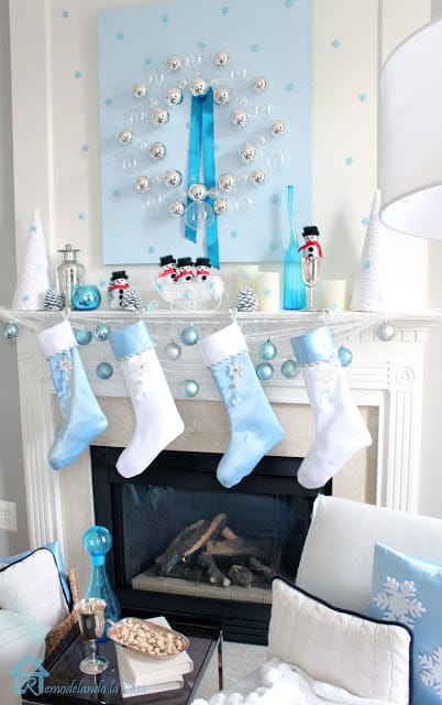 This mantel is decorated in silver, white and light blues.