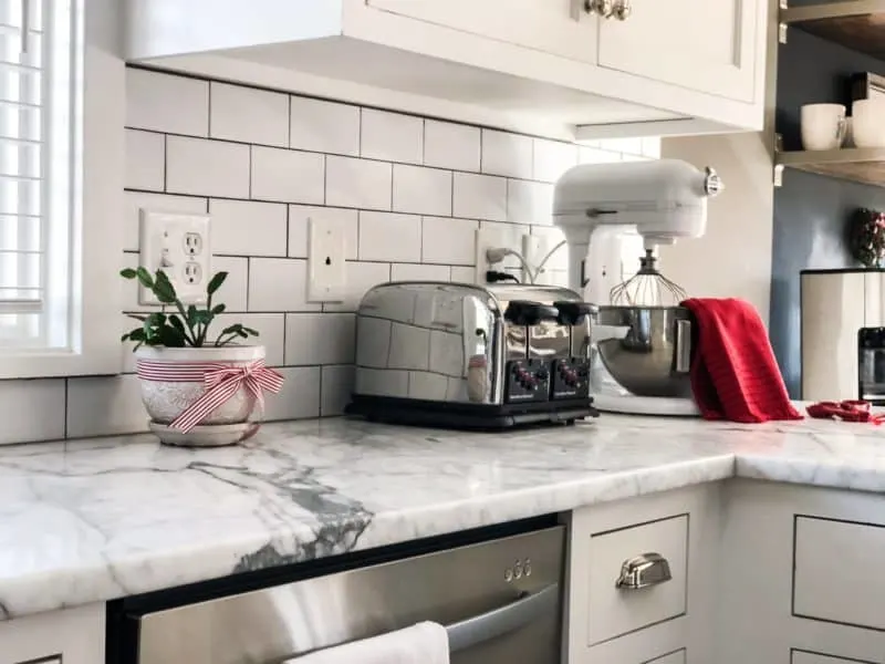 Counter view of my Kitchen Aid mixer, toaster with lots of red touches.