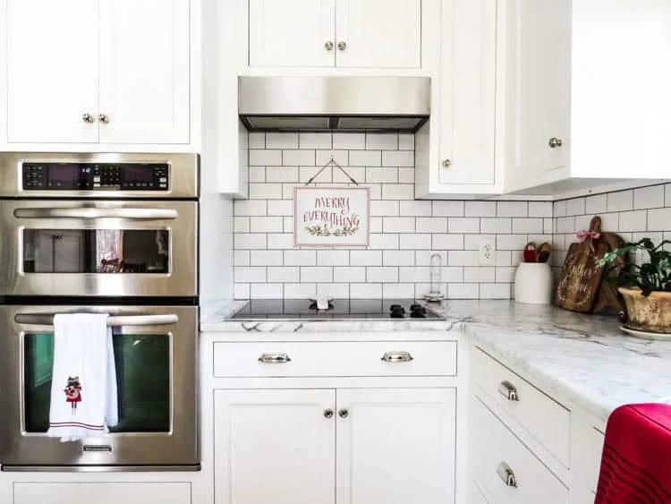 View of ovens, stove and merry everything sign.