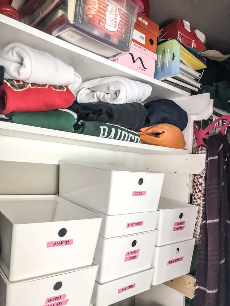 Closet Organization with stacked boxes.