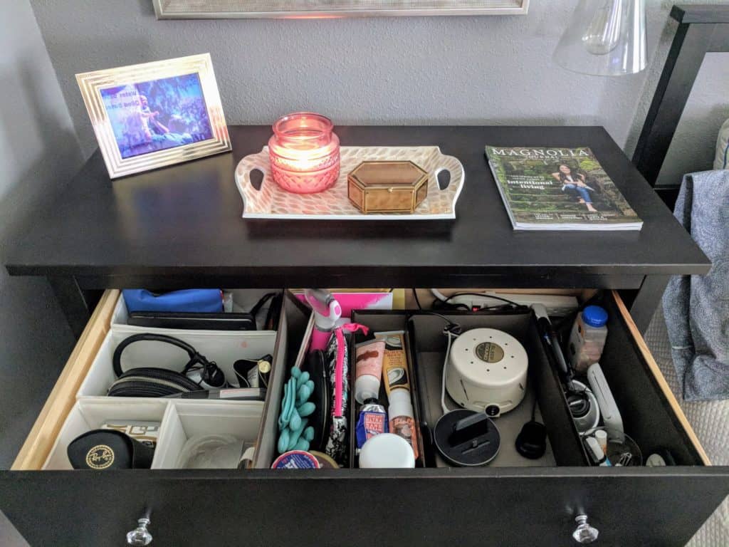 A view of the finished drawer with storage boxes to hold all her things.