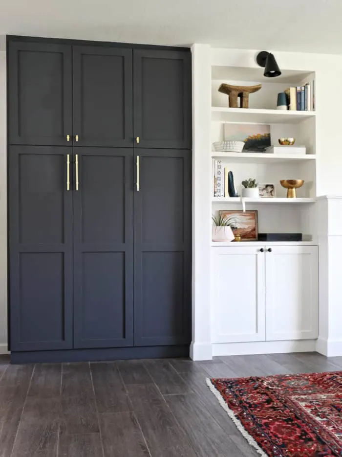 IKEA Hack, taking the Pax wardrobe and creating a pantry from it. Also painting it a stunning dark gray color white pops off all the other white cabinetry.
