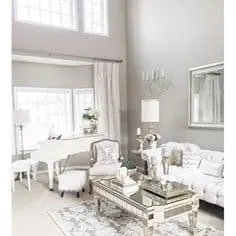 Amazing Gray Greige Paint Color in a family room with vaulted ceilings and tons of windows.