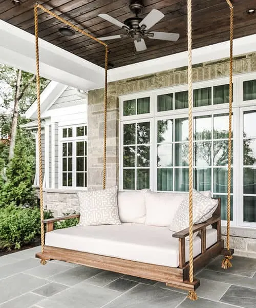 A relaxing porch swing that is big enough to sleep on!