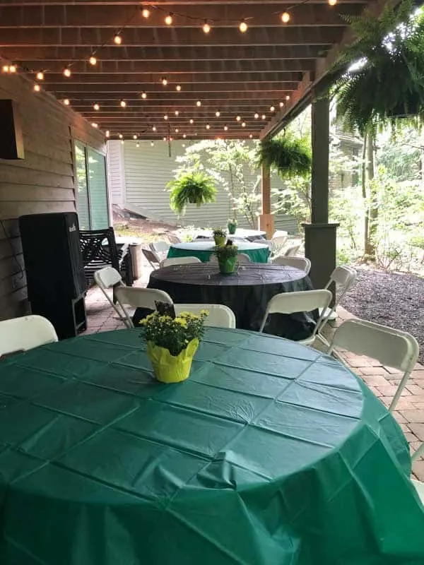 This shows the tables under the deck and the pretty centerpieces for the graduation party.
