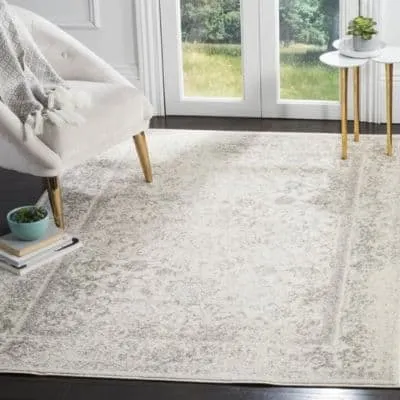 Best Place to Buy Rugs Online Feature image of a gray and ivory rug on dark hardwood floors.