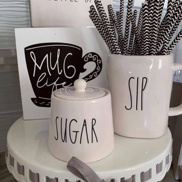 Rae Dun mug and sugar container displayed on a cake plate.