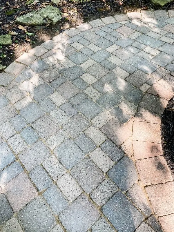 The after picture of the clean paver patio.