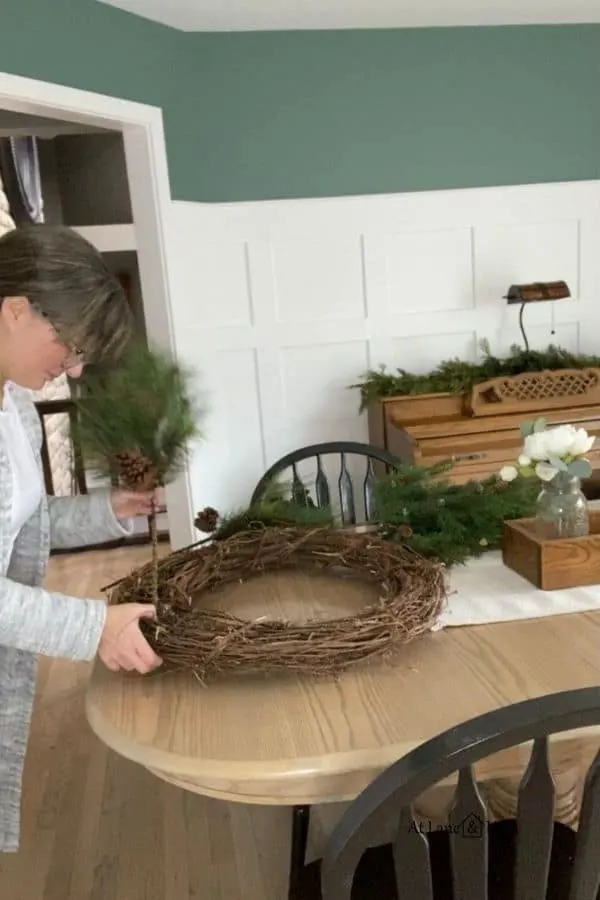 This shows how I put the first sprig into the winter wreath.