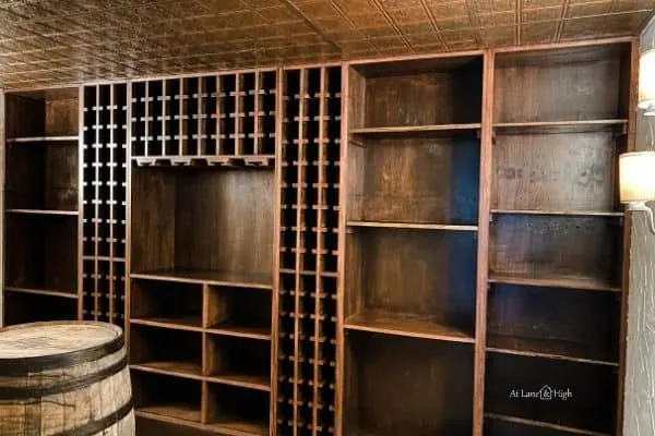 The wine cellar shelving after it was re-installed.  Where there were 4 shelves there are now 12!