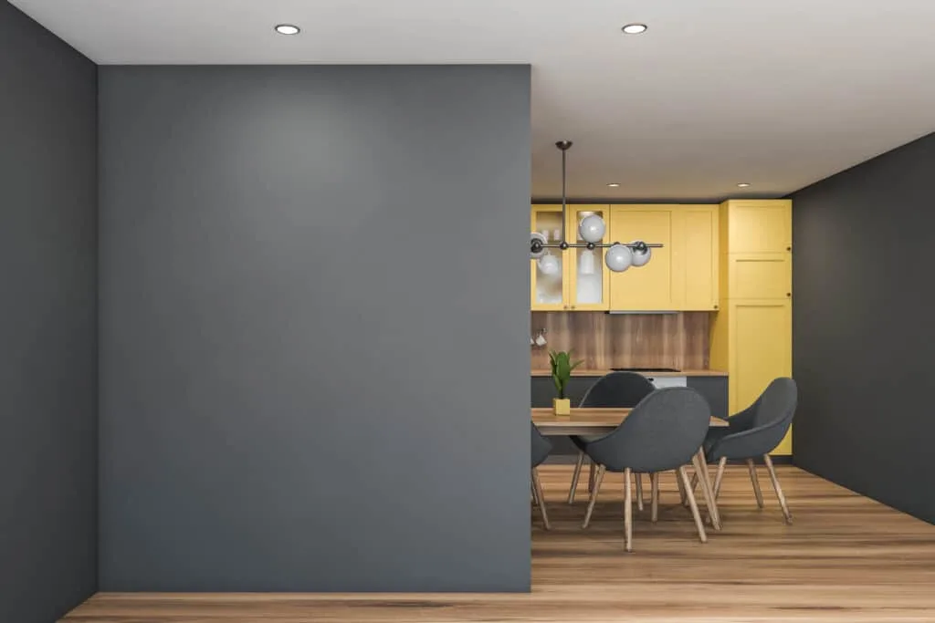 Pantone Ultimate Gray painted on the walls and Illuminating painted on the cabinets of a kitchen.