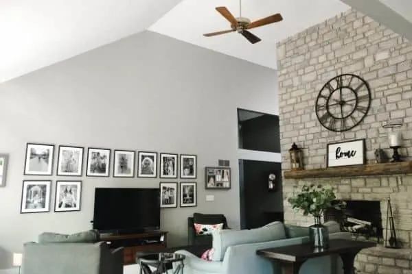 My family room with a dated wood ceiling fan that has no light fixture on it.