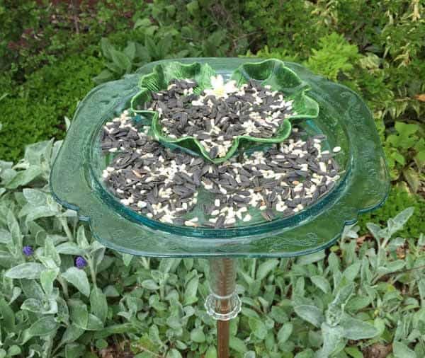 Old dishes made into a bird feeder.