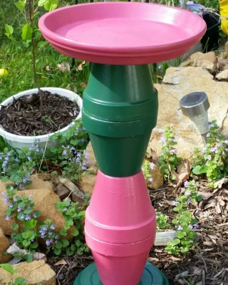 Terra Cotta pots painted and made to create a bird bath.