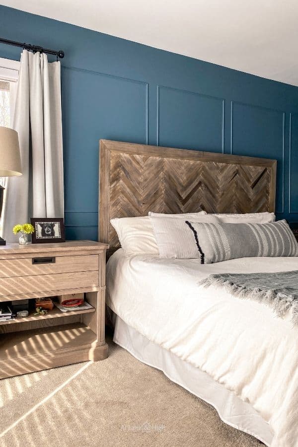 The finished bed with the diy herringbone headboard.