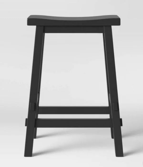 Black painted wooden bar stool that is rectangular and has no back.