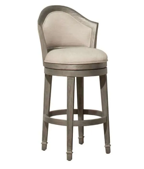 Brown wooden round bar stools with a light beige upholstered seat and back.