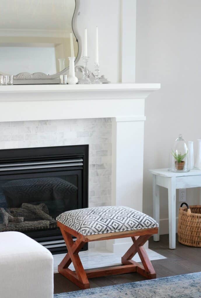 This beautiful mantel is painted with white dove and goes well with the carrera marble tile.