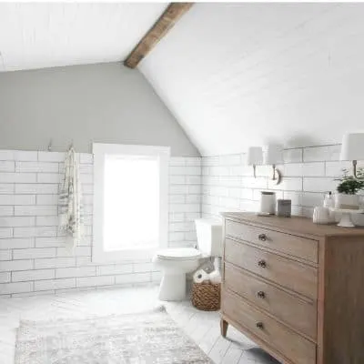 A bathroom with Mindful Gray on the wall above white subway tile.