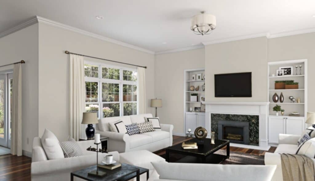 This family room has Worldly Gray on the walls and white sofas and chairs with dark wood floors.