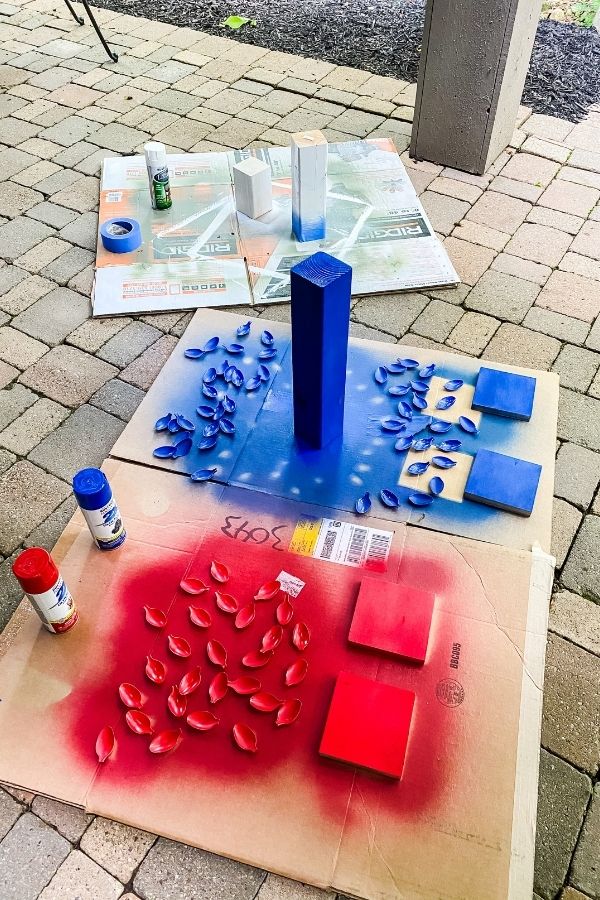 On my patio I have cardboard set out and spray painted my blocks of wood.