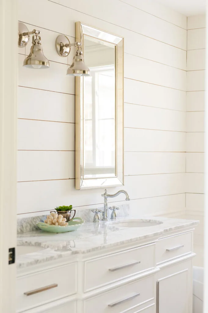 This shows Alabaster on the shiplap walls of a bathroom.