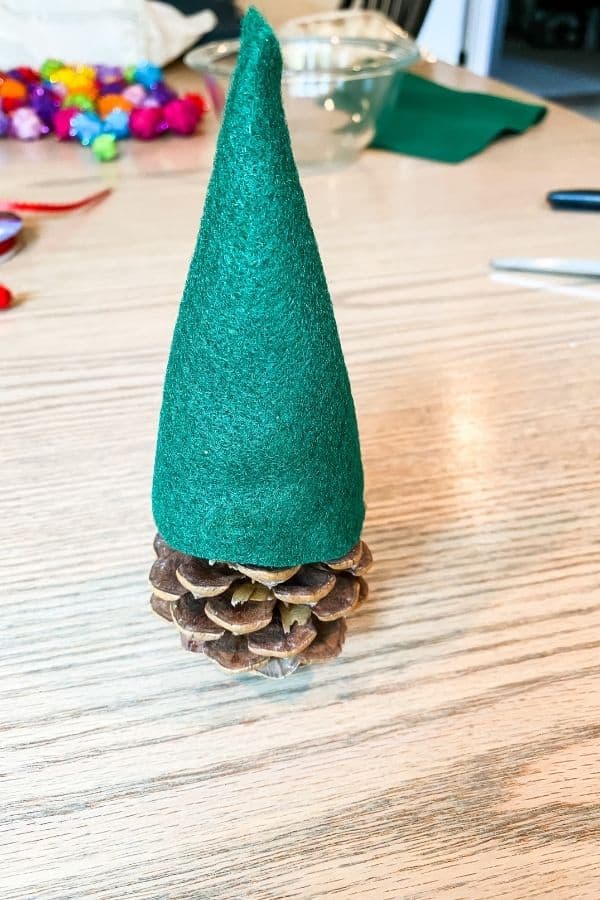 Here is the green felt cone glued to the pinecone.