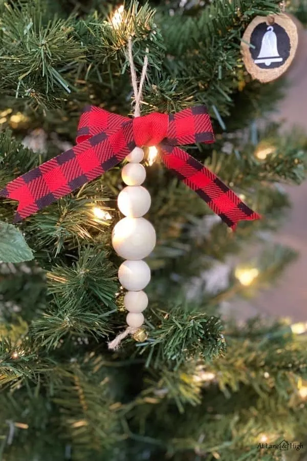 The wood bead ornaments hanging on the Christmas tree.