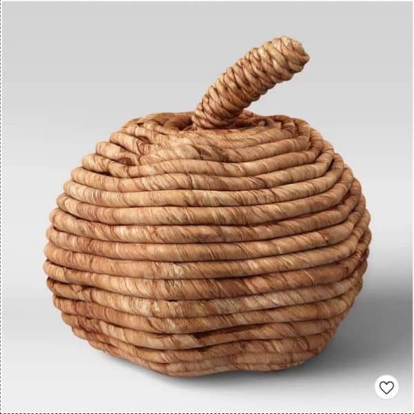 A woven pumpkin that is medium brown in color.
