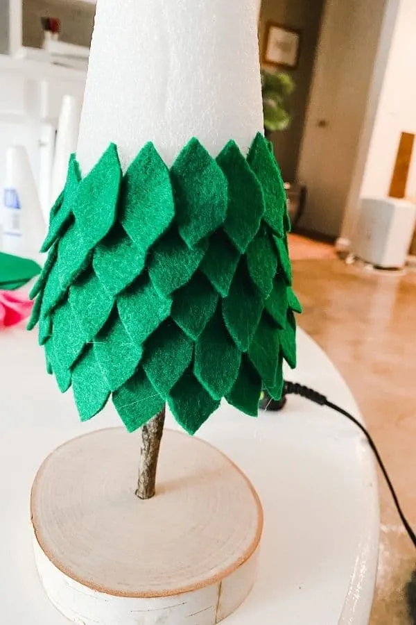 The green felt leaves are attached about halfway up the foam cone.