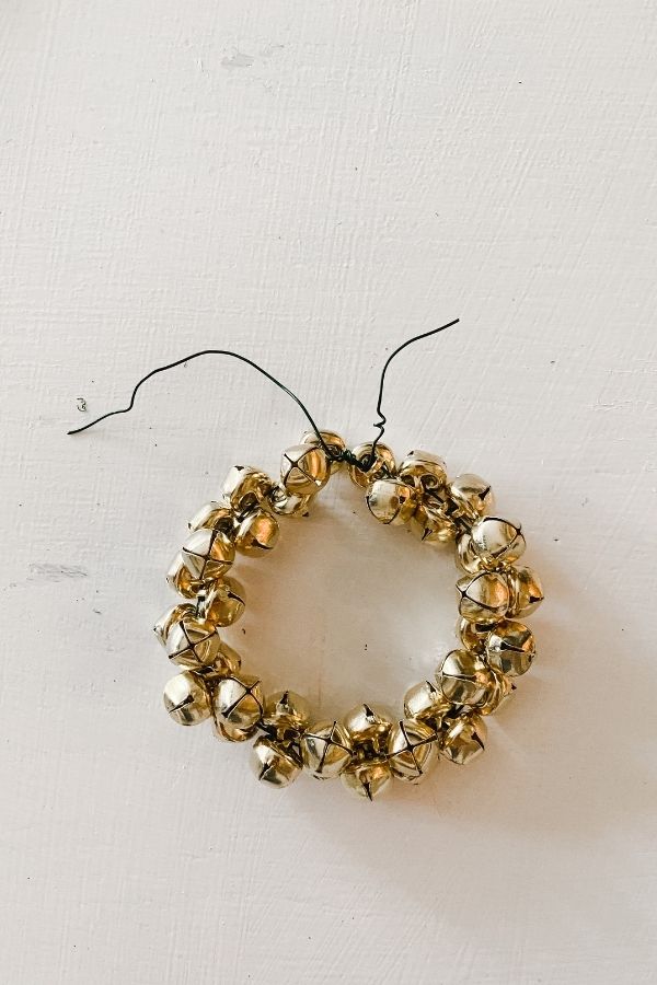 The gold jingle bells are on the wire and I wrapped the wire pieces around each other to complete the ring.