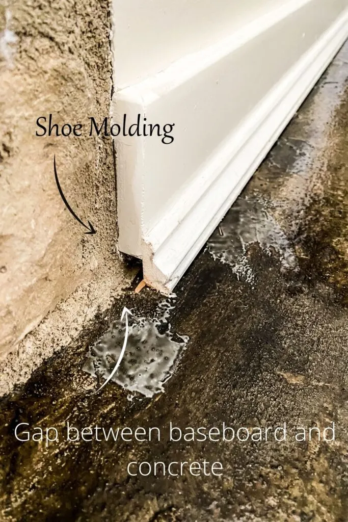 This shows the gap between the baseboard and the stained concrete floors.
