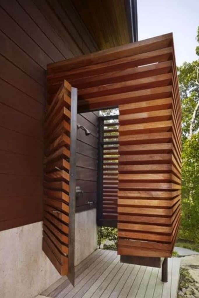 A horizontal privacy fence surrounding an outdoor shower.