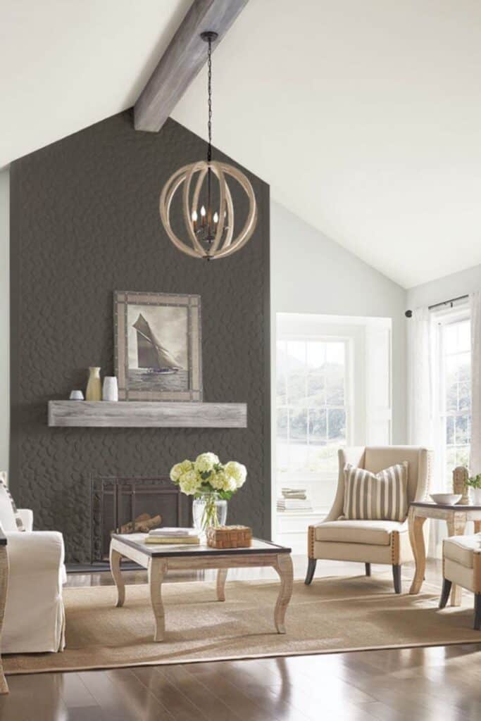 Urban Bronze used on an accent on a fireplace with dark wood floors, a light colored rug and furniture.